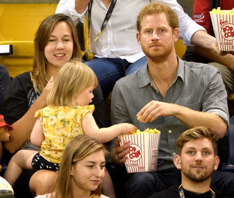 Prince Harry catches toddler stealing his popcorn in adorable scenes at Invictus Games